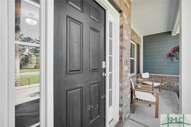 property entrance featuring covered porch