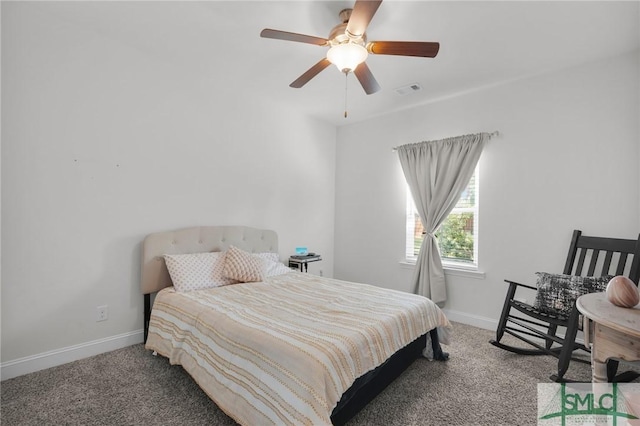 bedroom featuring carpet floors, visible vents, and baseboards