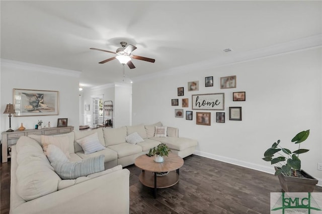 living room with crown molding, ceiling fan, baseboards, and dark wood finished floors