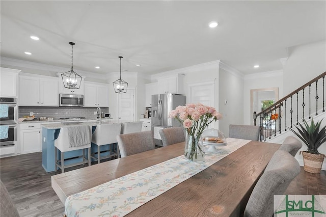 dining space featuring recessed lighting, dark wood-style flooring, crown molding, and stairs