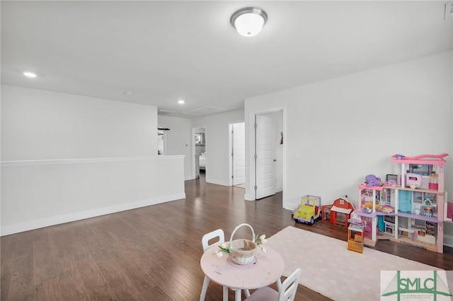 rec room featuring baseboards, wood finished floors, and recessed lighting