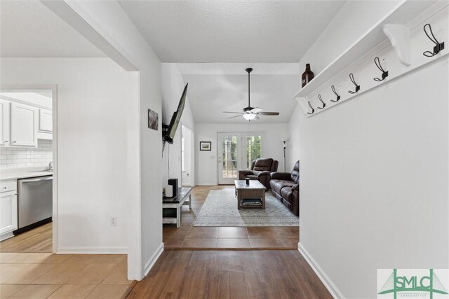 605 Weisenbaker Rd, Rincon, GA 31326 - corridor with light tile patterned floors, baseboards, and vaulted ceiling