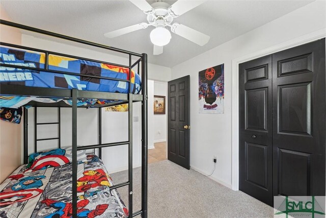 605 Weisenbaker Rd, Rincon, GA 31326 - bedroom with a closet, ceiling fan, carpet, and baseboards
