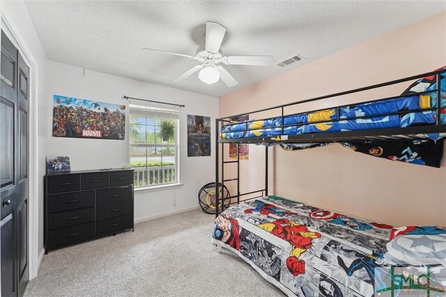 605 Weisenbaker Rd, Rincon, GA 31326 - bedroom featuring visible vents, a closet, light colored carpet, and a textured ceiling