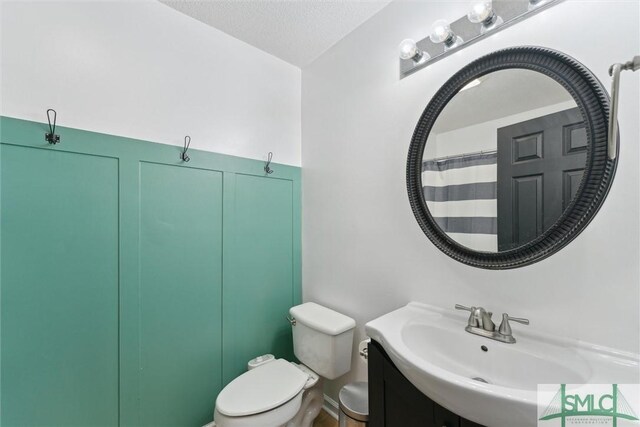 605 Weisenbaker Rd, Rincon, GA 31326 - full bathroom featuring toilet, a textured ceiling, and vanity