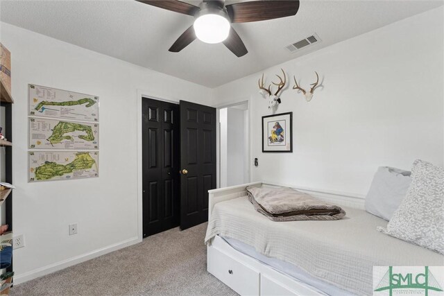 605 Weisenbaker Rd, Rincon, GA 31326 - bedroom featuring ceiling fan, a closet, visible vents, light carpet, and baseboards