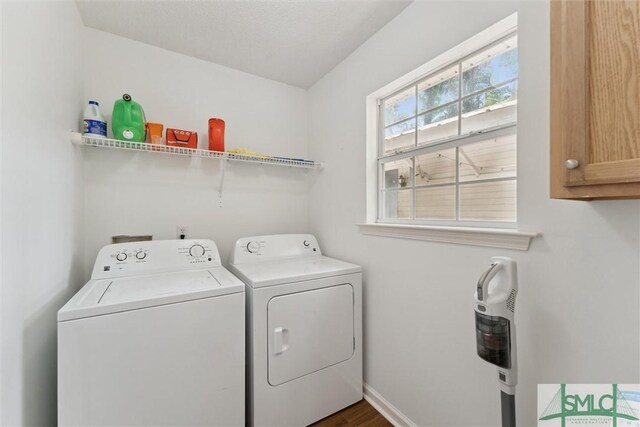 605 Weisenbaker Rd, Rincon, GA 31326 - washroom featuring dark wood-type flooring, baseboards, washing machine and clothes dryer, and cabinet space