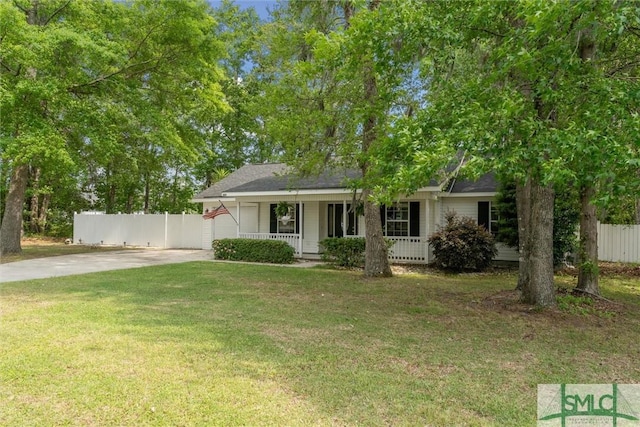 605 Weisenbaker Rd, Rincon, GA 31326 - view of front of house featuring a front lawn, fence, covered porch, and driveway