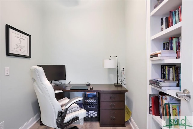 office with baseboards and wood finished floors