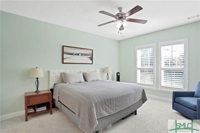 bedroom featuring visible vents, baseboards, and carpet