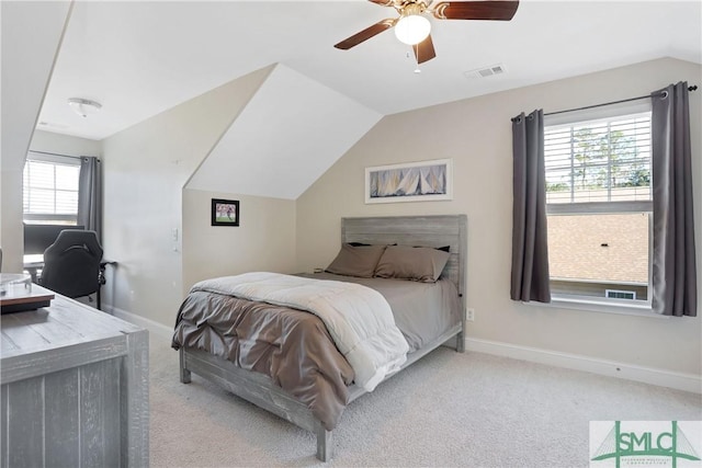 bedroom with visible vents, baseboards, a ceiling fan, vaulted ceiling, and light carpet