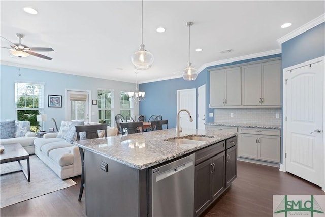 kitchen featuring a sink, a wealth of natural light, dishwasher, and dark wood-style floors