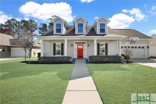 new england style home featuring an attached garage, roof with shingles, driveway, and a front lawn