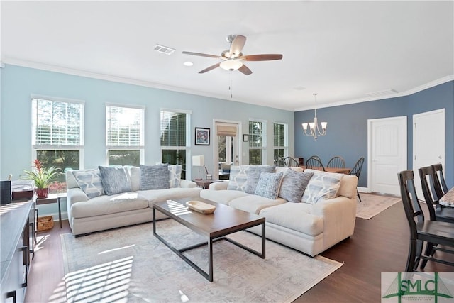living room with visible vents, crown molding, and a healthy amount of sunlight