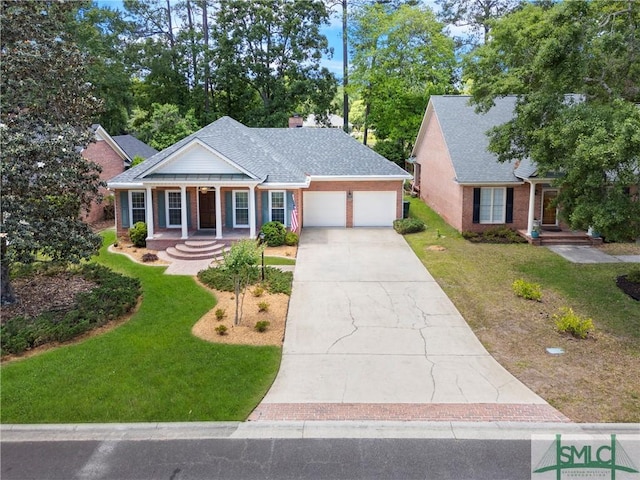 16 Oak Park Pt, Savannah, GA 31405 - neoclassical / greek revival house featuring an attached garage, a front lawn, driveway, and a chimney