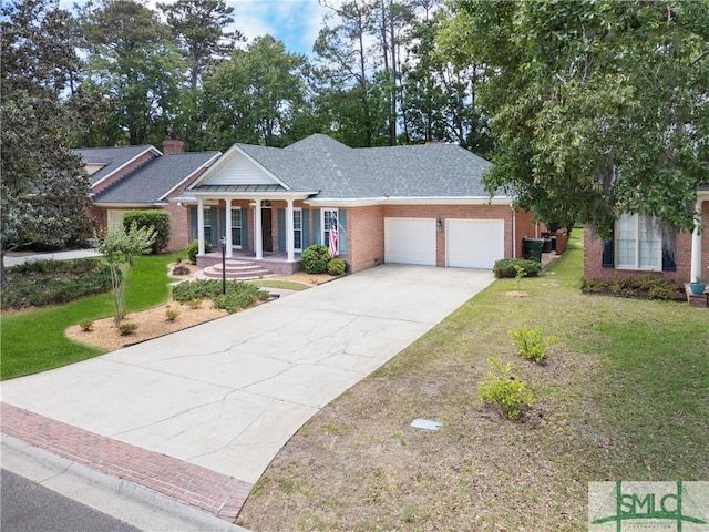 16 Oak Park Pt, Savannah, GA 31405 - greek revival inspired property with a porch, brick siding, an attached garage, and a front lawn