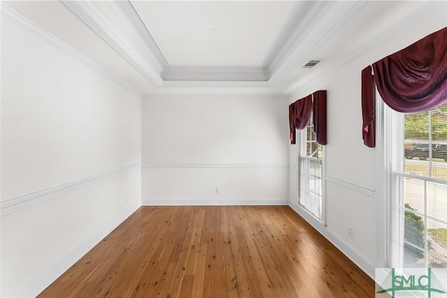 16 Oak Park Pt, Savannah, GA 31405 - unfurnished room with crown molding, a wealth of natural light, hardwood / wood-style flooring, and visible vents