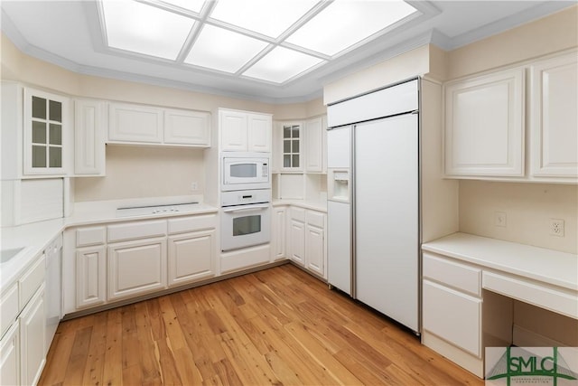 16 Oak Park Pt, Savannah, GA 31405 - kitchen featuring light wood-style floors, white cabinetry, built in appliances, and glass insert cabinets