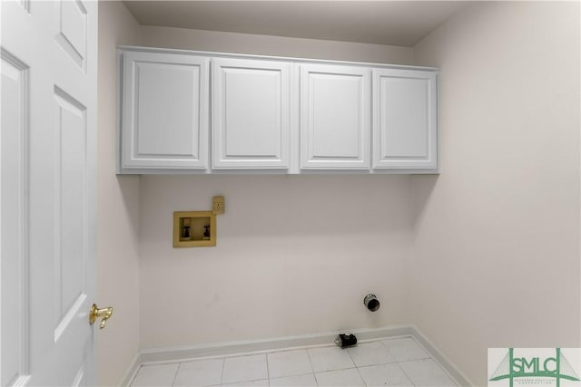 16 Oak Park Pt, Savannah, GA 31405 - clothes washing area featuring cabinet space, baseboards, light tile patterned floors, and hookup for a washing machine