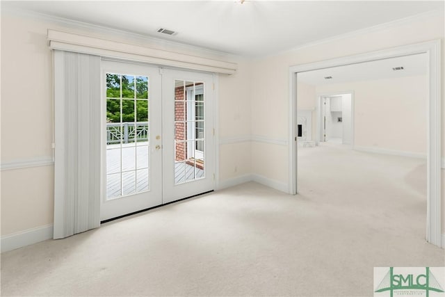 16 Oak Park Pt, Savannah, GA 31405 - doorway with french doors, visible vents, baseboards, ornamental molding, and carpet flooring