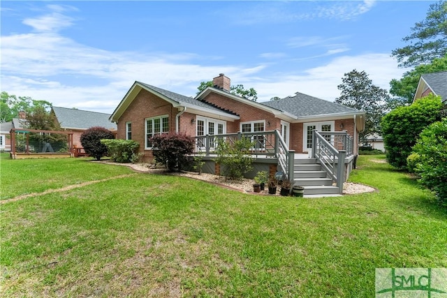 16 Oak Park Pt, Savannah, GA 31405 - view of front of property featuring a chimney, a front lawn, a deck, and brick siding