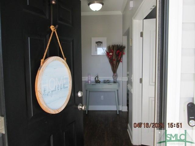 25 Frank Edwards Rd, Ellabell, GA 31308 - foyer entrance featuring crown molding, baseboards, and dark wood-style floors