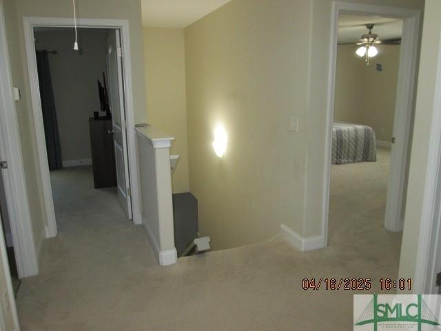 25 Frank Edwards Rd, Ellabell, GA 31308 - hall featuring light carpet, baseboards, and an upstairs landing