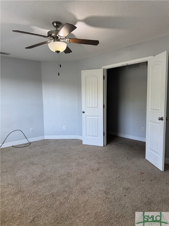 204 Grandview Dr, Hinesville, GA 31313 - unfurnished bedroom with carpet, a textured ceiling, a ceiling fan, and baseboards
