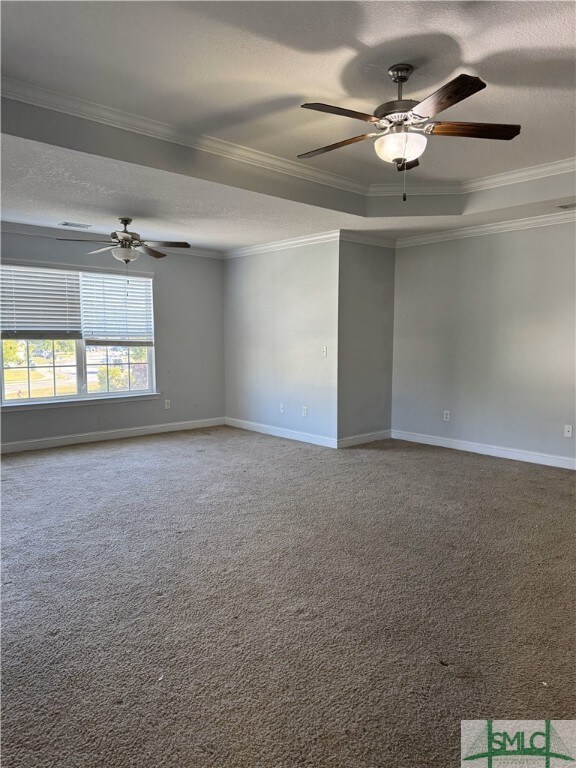 204 Grandview Dr, Hinesville, GA 31313 - carpeted empty room featuring a textured ceiling, ornamental molding, baseboards, and ceiling fan