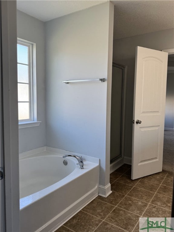 204 Grandview Dr, Hinesville, GA 31313 - bathroom with a bath, tile patterned floors, a shower stall, and baseboards