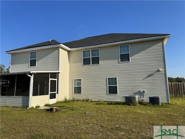 204 Grandview Dr, Hinesville, GA 31313 - back of house featuring central air condition unit, a sunroom, and a yard