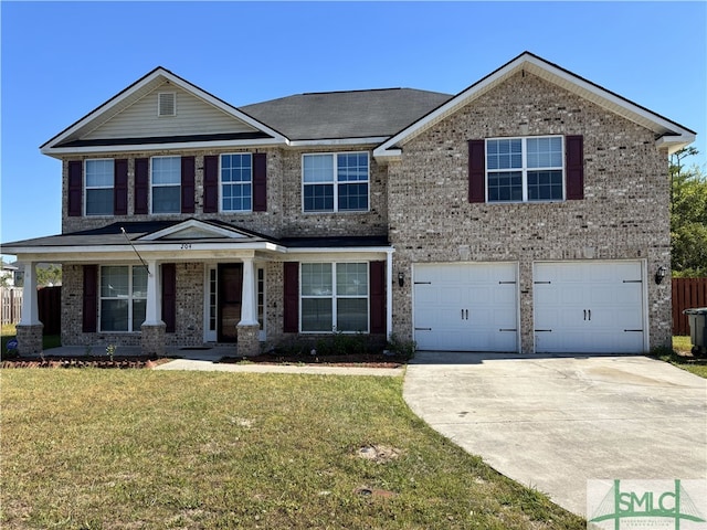 204 Grandview Dr, Hinesville, GA 31313 - view of front of house with brick siding, an attached garage, a front lawn, and concrete driveway