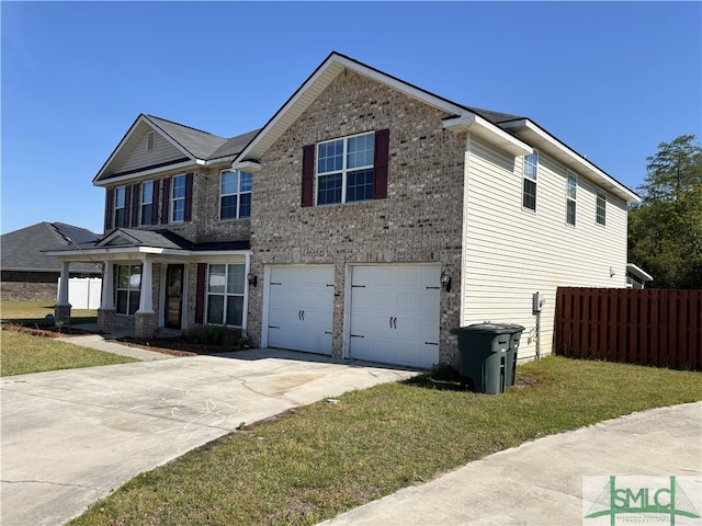 204 Grandview Dr, Hinesville, GA 31313 - view of front of home featuring fence, a front lawn, driveway, and a garage