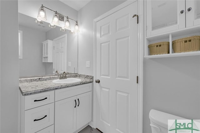 half bath with vanity and toilet