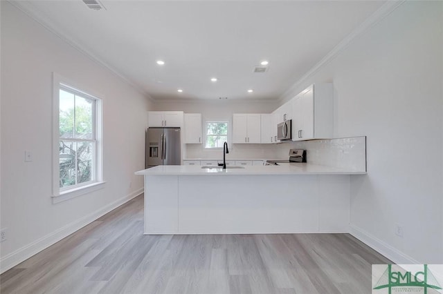 1615 Le Grand St, Savannah, GA 31401 - kitchen with light countertops, ornamental molding, and stainless steel appliances