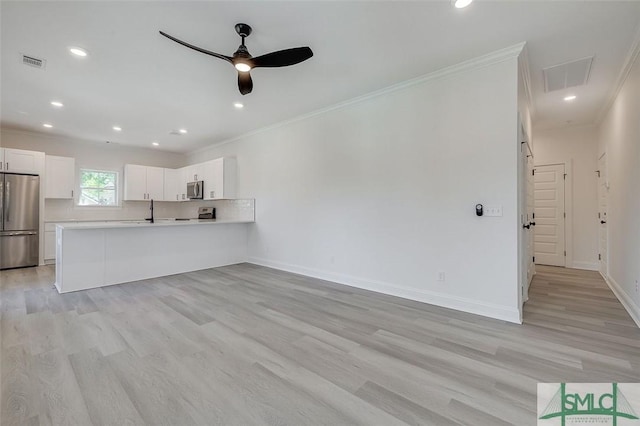 1615 Le Grand St, Savannah, GA 31401 - unfurnished living room with light wood-style flooring, visible vents, ornamental molding, and a ceiling fan