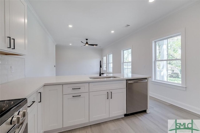1615 Le Grand St, Savannah, GA 31401 - kitchen with a sink, stainless steel appliances, light wood finished floors, light countertops, and recessed lighting