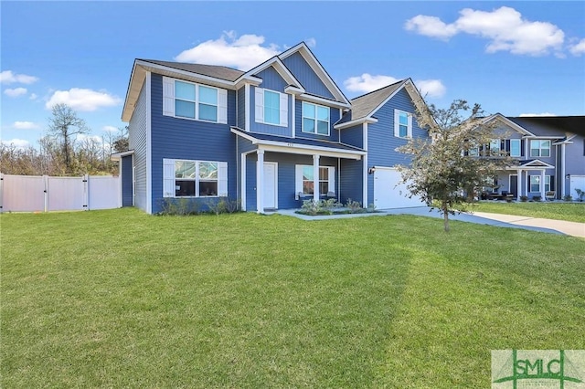 view of front of property with a gate, a front lawn, fence, and a garage