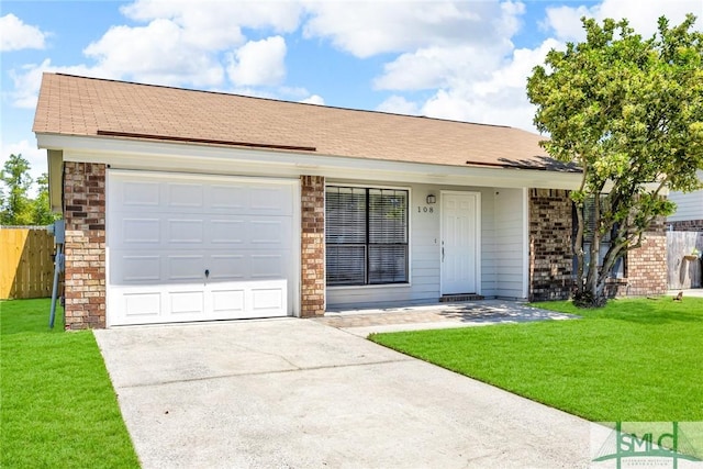 ranch-style house with brick siding, driveway, a garage, and a front yard