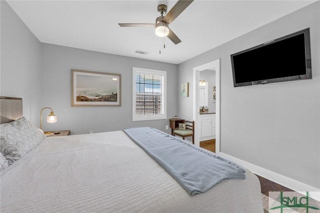 bedroom with visible vents, a ceiling fan, baseboards, and ensuite bathroom