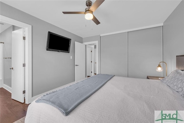 bedroom featuring wood finished floors, a closet, and ceiling fan