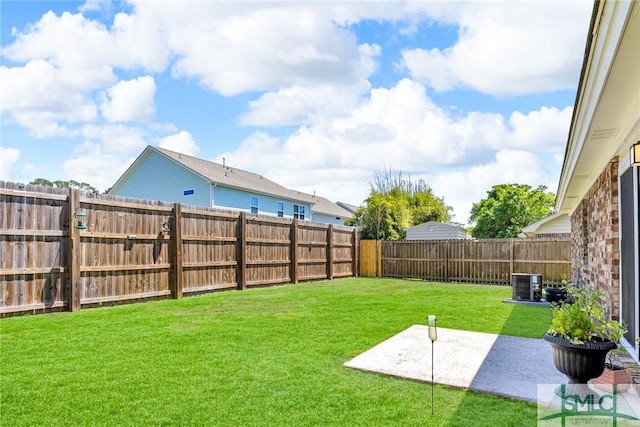 view of yard featuring cooling unit, a patio area, and a fenced backyard