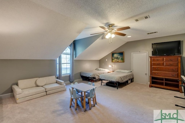 bedroom featuring carpet floors, visible vents, and lofted ceiling