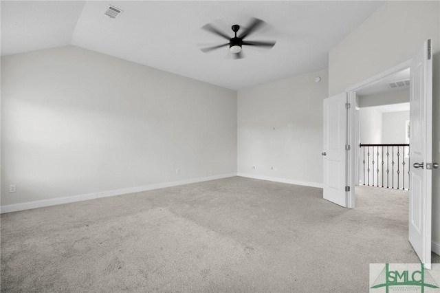 carpeted empty room with baseboards, visible vents, and ceiling fan