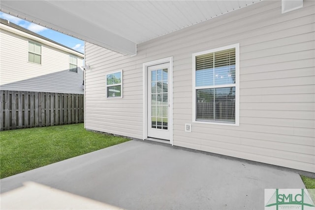 view of patio featuring fence