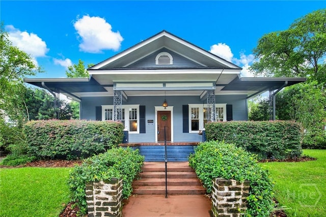 128 E 48th St, Savannah, GA 31405 - view of front of home with a porch and a front lawn
