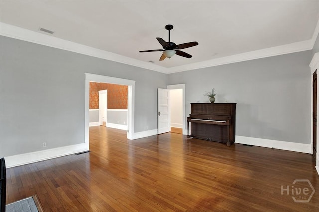 128 E 48th St, Savannah, GA 31405 - unfurnished living room featuring a ceiling fan, dark wood finished floors, and crown molding