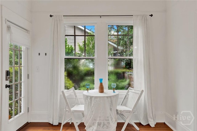 128 E 48th St, Savannah, GA 31405 - dining area with healthy amount of natural light and wood finished floors