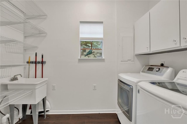 128 E 48th St, Savannah, GA 31405 - laundry area featuring cabinet space, washing machine and clothes dryer, and dark wood finished floors
