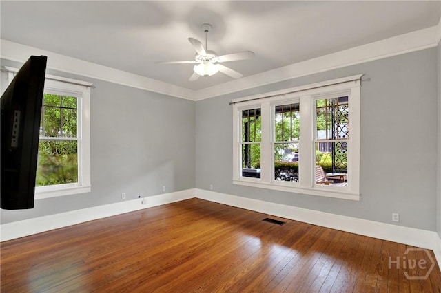 128 E 48th St, Savannah, GA 31405 - empty room featuring dark wood-type flooring and ceiling fan
